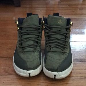 Pair of olive green and white Jordan’s size 7